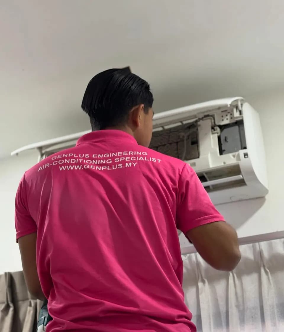 GenPlus Engineering technician completing wall-mounted aircond installation work