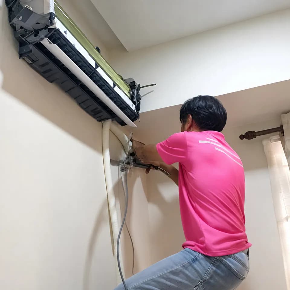 GenPlus technician working on aircond piping during an installation